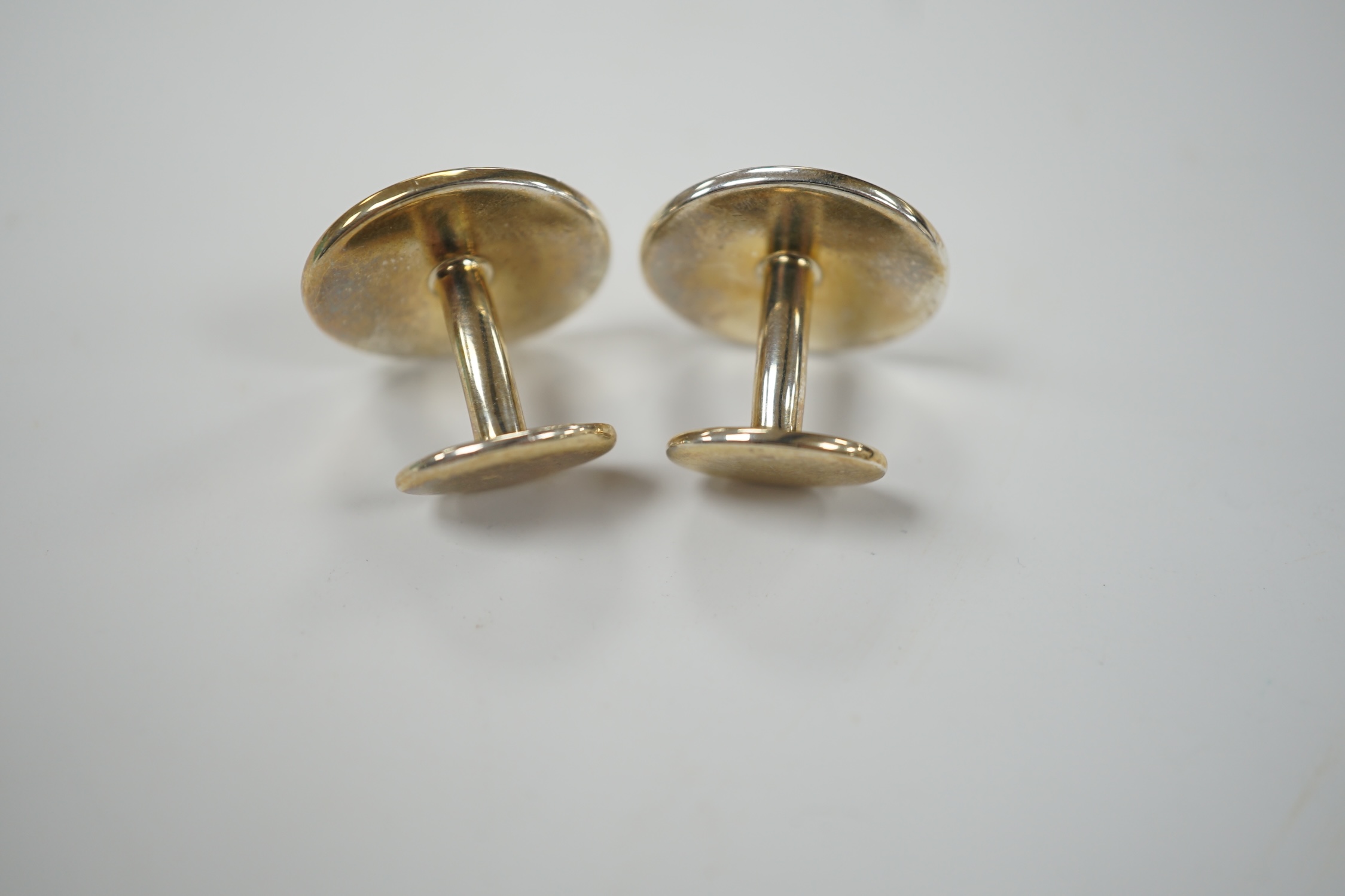 A modern pair of Tiffany & Co gilt 925 oval cufflinks, 19mm, with pouch and box.